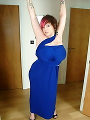 Busty Dors squeezes tits into tight blue dress and plays with pussy